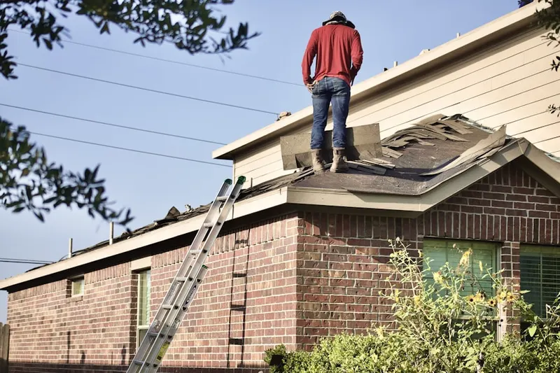 Professional roofer working on a residential roof in Windcrest
